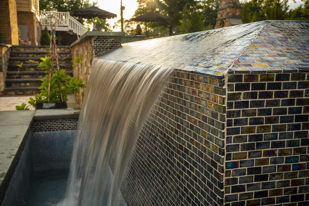 pool-and-waterfall-with-hardscaping
