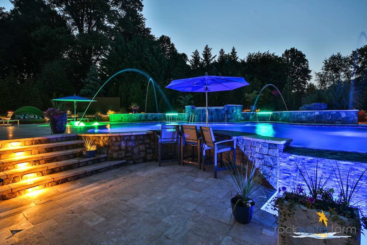 pool with fountain and nightlighting